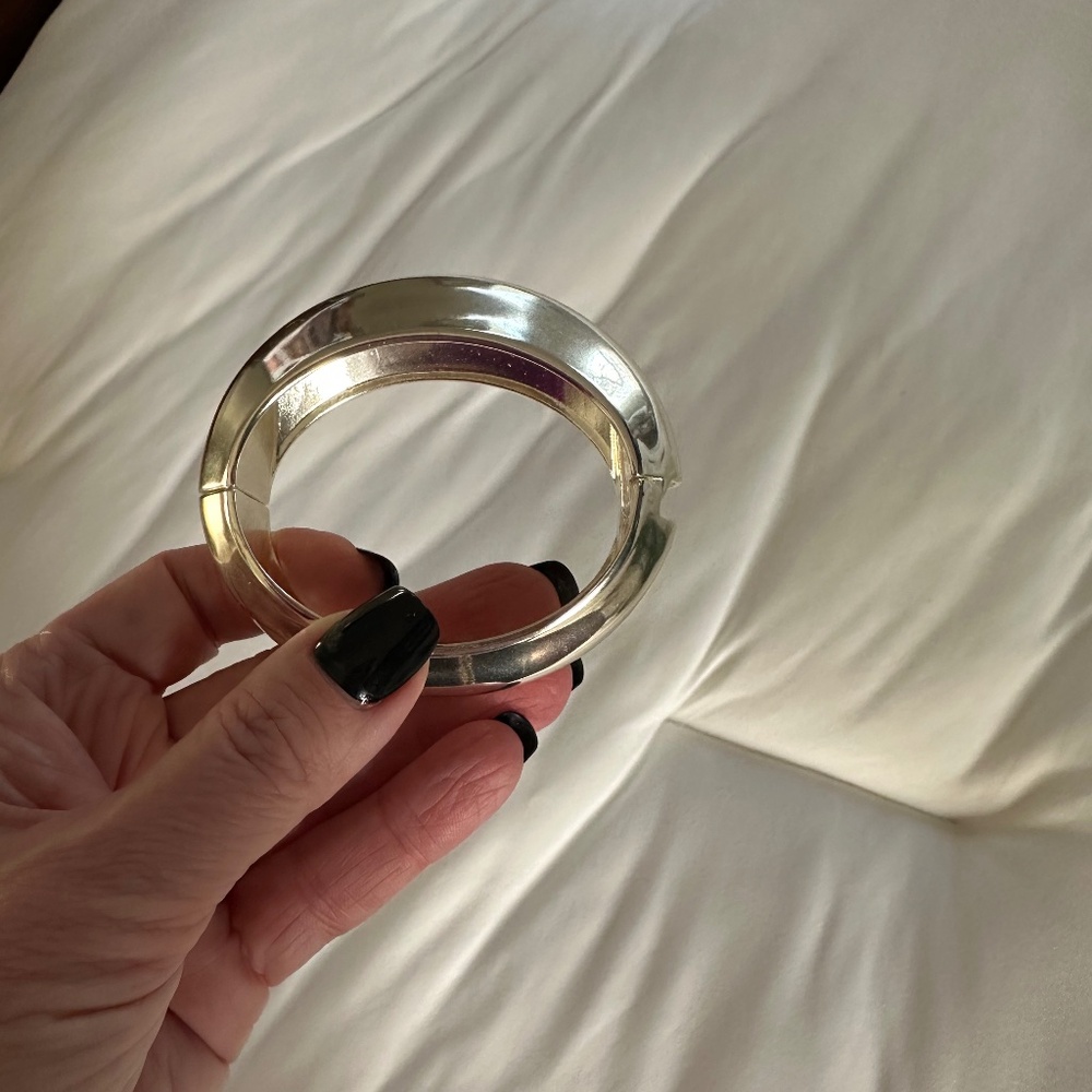 Silver tone hinged bangle
